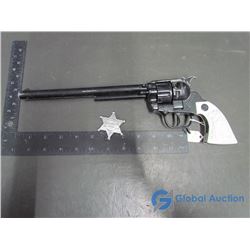 Toy Gun and Sheriff Toy Badge