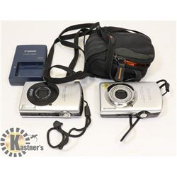 FLAT WITH 2 CANNON DIGITAL CAMERAS, ONE CHARGER,