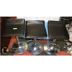 3 LEATHERETTE STOOLS WITH NO BACK.