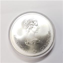 Silver Olympia 10Dollar C (~weight 54.77g), Suggested Retail Value $30 (Estimated Selling Price from