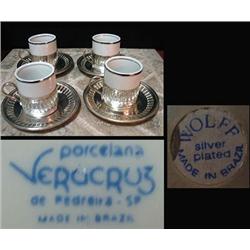 Set of four silver plate demi cup holde