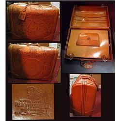 Hand tooled leather suit case in good u