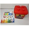 Image 1 : red container of lego/lego ideas book