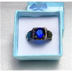 14)  BLUE SAPPHIRE SET IN 18K RAINBOW