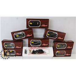 BOX OF 8 LILIPUT TRAIN CARS.