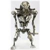 STEAM PUNK STYLE PREDATOR-LIKE FIGURE.