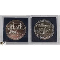 TWO CANADIAN SILVER DOLLAR COINS.