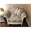 Image 1 : OVER SIZED LOUNGE CHAIR WITH FLORAL PRINT AND WOOD TRIM.