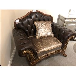 DARK BROWN LEATHER OVER SIZED LOUNGE CHAIR WITH WOOD TRIM AND THROW CUSHION.  RETAIL $4,580.00