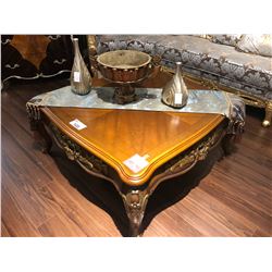 CARVED WOOD COFFEE TABLE WITH TABLE RUNNER AND DECOR ITEMS.