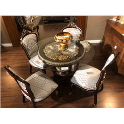 FORMAL DINING ROOM SET WITH ROUND GLASS TOP WITH CARVED BASE TABLE AND FOUR CHAIRS.