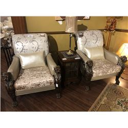 PAIR OF LEATHER BACK OVER SIZED LOUNGE CHAIRS WITH CARVED LIONS HEAD ARM RESTS.