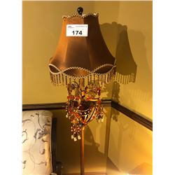 BEADED FLOOR LAMP WITH METAL BASE.