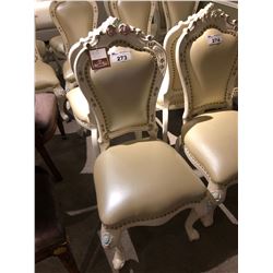 PAIR OF BRASS TACKED IVORY COLOURED FORMAL DINING ROOM CHAIRS.  RETAIL $2,400.00