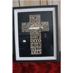 A Cross with the Lords Prayer Carved into It