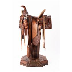 William M. Churchill Jr., hand-carved wooden saddle