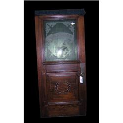 Solid wood carved door with "Saloon" on the glass