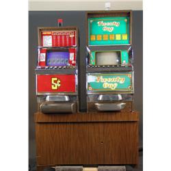 Lot of 2 slot machines mounted on 1 base cabinet