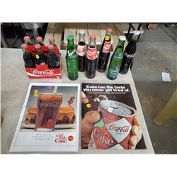 12 FULL POP BOTTLES & TWO COCA COLA ADVERTISING PIECES