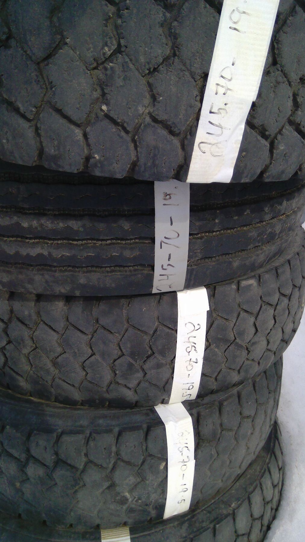 FIVE MISMATCHED TREAD TIRES 245/70/19.5