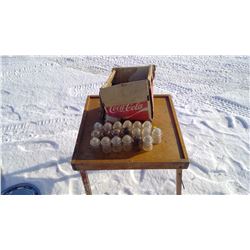 DAMAGED COKE BOX, 19- INSULATERS 9 HAVE CHIPS, & WOODEN FOLDING TABLE