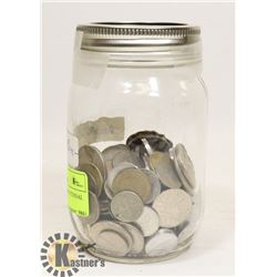 JAR OF ASSORTED INTERNATIONAL COINS.