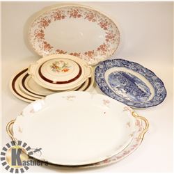 STACK OF ASSORTED SERVING PLATERS AND DISHES