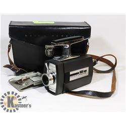 BELL & HOWELL 8MM CAMERA WITH SPOT LIGHT.