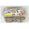 Image 1 : OVER ONE POUND OF STAMPS, MOST ARE CANADIAN.