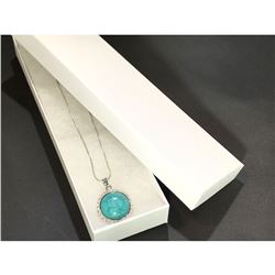 Contemporary silver necklace with turquoise rhinestone.