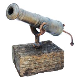 Early 19th-century American bronze swivel-mount cannon with iron tiller.