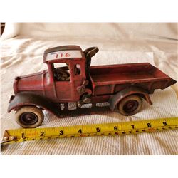 CAST IRON ARCADE DUMP TRUCK WITH DRIVER, RUBBER WHEELS, MARKED 'ARCADE IN CAST'