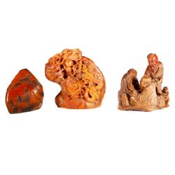 Three Chinese stone carvings.