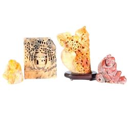 Four Chinese stone carvings.