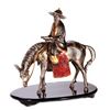 Image 1 : A mixed metal sculpture of a horseman.