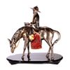 Image 2 : A mixed metal sculpture of a horseman.