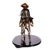 Image 8 : A mixed metal sculpture of a horseman.