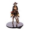 Image 9 : A mixed metal sculpture of a horseman.