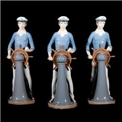 Three Lladro porcelain sailors.