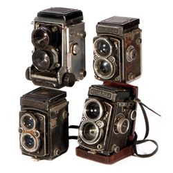 Four vintage cameras.