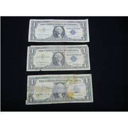 (3) 1957 One Dollar Silver Certificates, One is badly Damaged