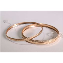 Two 10kt yellow gold bangles