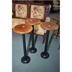 Three antique metal base with wood seat ice-cream parlour stools, 30" in height