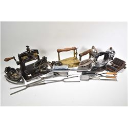 Selection of antique collectibles including two fabric fluters, two electric irons, two gas irons, a