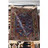 Image 1 : Antique throw rug with blue background and highlights of green, taupe, cream etc. note needs refring