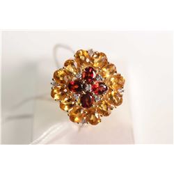 New old stock 14kt yellow gold, garnet, citrine and diamond gemstone ring. Set with .72cts of oval m