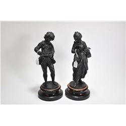 Two small cast statues including young man writing and young lady reading 13" in height including ba