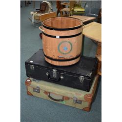 Two vintage suitcases and a modern simulated barrel with metal bindings for recycling