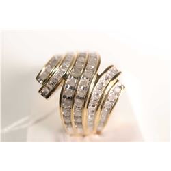 New old stock 10kt yellow gold and diamond ring. Set with 1.00cts of round cut and baguette white di