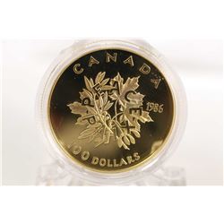 Canadian 1986 non- circulated $100 gold coin depicting a maple and an olive branch by Toronto artist